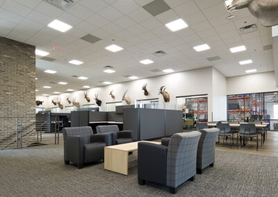 Modern distribution center and corporate office employee lounge and cubicles
