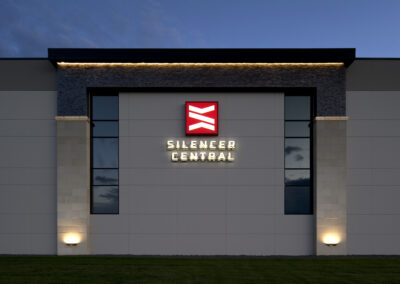 Modern distribution center exterior with exterior lighting at dusk