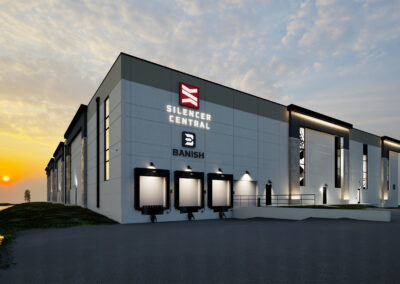 rendering of Modern distribution center and loading docks exterior with exterior lighting at dusk